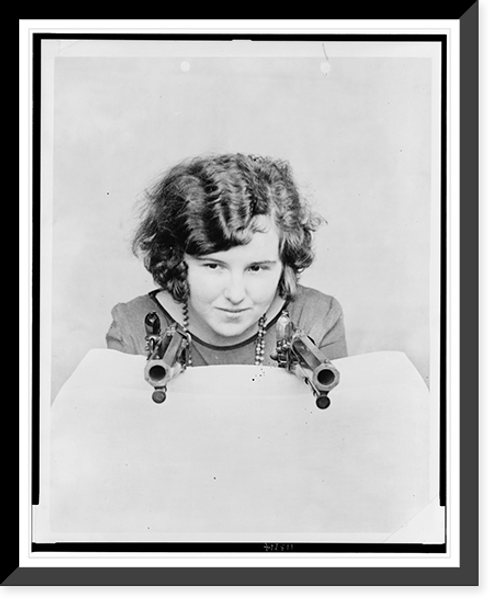 Historic Framed Print, [Miss Grace Stockman with President Andrew Jackson's dueling pistols, at the National Museum],  17-7/8" x 21-7/8"