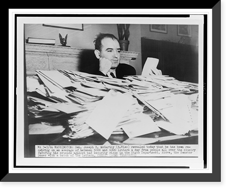 Sen. Joseph R. McCarthy sits at desk piled high with mail, Antique Wall Art