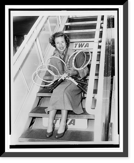 Maureen Connolly holding five tennis rackets while she sits on the boarding steps of airplane, Vintage Print