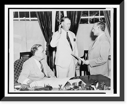 Supreme Court Justice Felix Frankfurter administers oath of office to Secretary of Navy, Col. Frank Knox, as President Franklin D. Roosevelt, seated, looks on, Historic Print