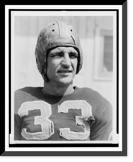 Sammy Baugh, head-and-shoulders portrait, wearing football jersey and helmet.photo by Tenschert Photo Co, Vintage Print