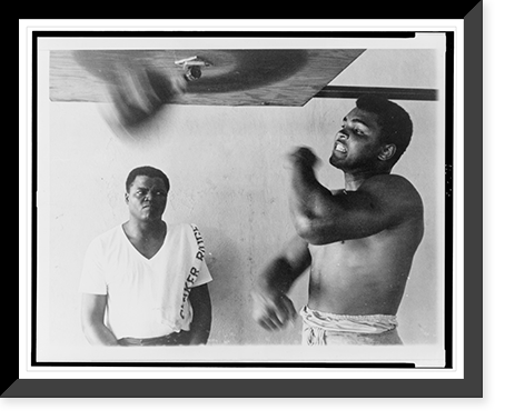 Muhammad Ali, formerly Cassius Clay, works out on light bag in Miami Classic, Vintage Print