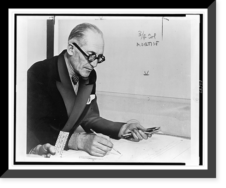 Le Corbusier, half-length portrait, seated at desk, facing right, working on drawing, Antique Wall Art