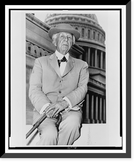 Frank Lloyd Wright, three-quarter length portrait, seated, facing front, outside the U.S. Capitol building Classic, Vintage Poster