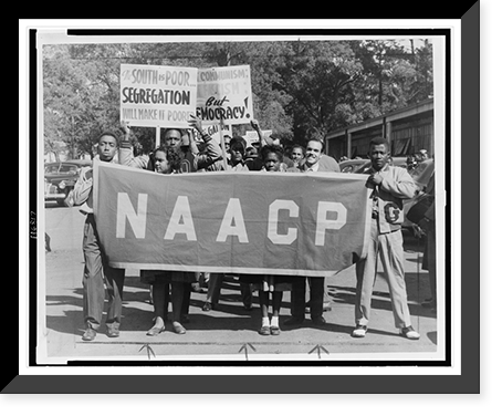 People marching with signs to protest segregation in education at the college and secondary levels.J.H. Lawson, Houston, Texas. Classic, Vintage Print