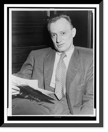 Nelson Algren, half-length portrait, seated, facing front, holding copy of his book A Walk on the Wild Side".World Telegram photo by Walter Albertin." Classic, Antique Print