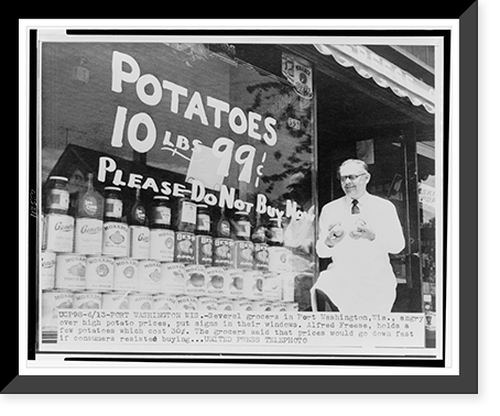 Grocer Alfred Freese Port Washington, Wis., holds potatoes in front of sign painted on store window encouraging customer not to purchase potatoes, Vintage Poster