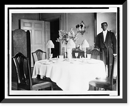 Butler standing by dining room table in residence of Mr. and Mrs. Woodrow Wilson, Historic Reproduction