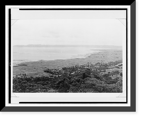 Aerial view of village in distance, and damaged coastline, which had been protected by a sea wall in pre-war years, Okinawa, Antique Wall Art