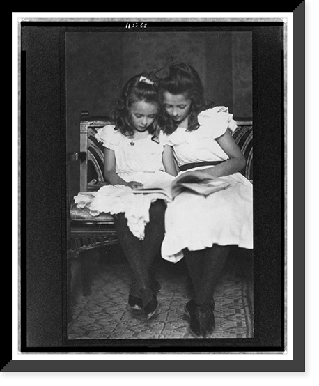 Two girls wearing white dresses and dark stockings reading a book - 2, Historic Print