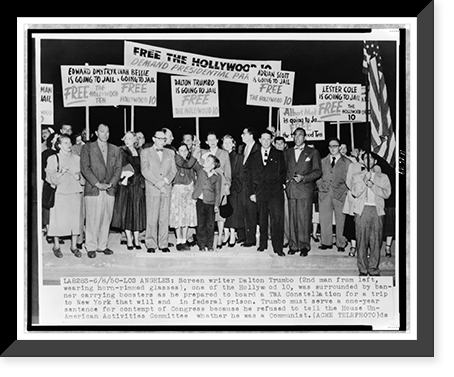 Historic Framed Print, [Hollywood screenwriter, Dalton Trumbo (2nd man from left, wearing horn-rimmed glasses) surrounded by supporters with signs, as he waits to board TWA airplane on his way to federal prison in New York],  17-7/8" x 21-7/8"