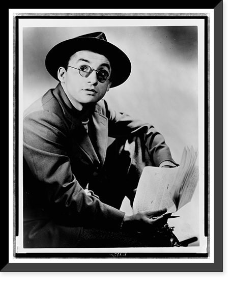 Arch Oboler, half-length portrait, seated, facing right, wearing hat and glasses, holding paper and pencil, Antique Wall Art