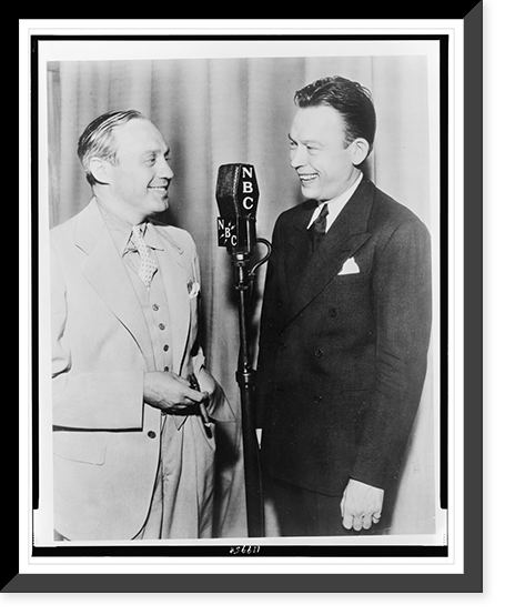 Fred Allen (right) and Jack Benny, three-quarter length portrait, standing before microphone, facing each other Classic, Historic Print