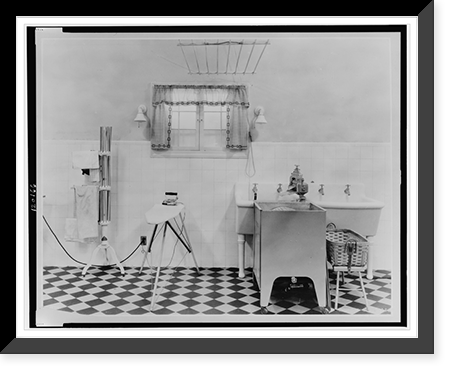 Rack, ironing board and iron, tubs, and washing machine in a model home laundry, Historic Reproduction