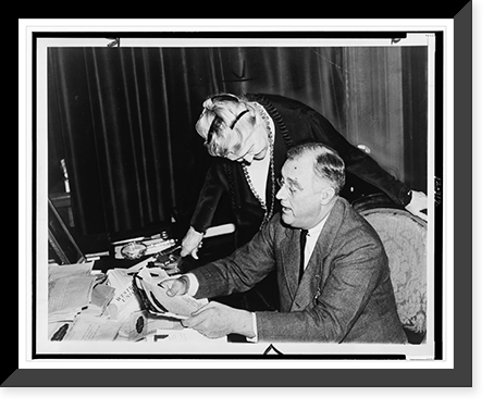 President Franklin D. Roosevelt seated at desk with his mother, Mrs. James Roosevelt, reading congratulatory letters at his Hyde Park, New York, estate, Historic Print