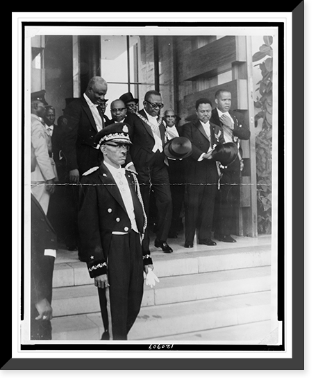 Liberian President William Tubman, three-quarter length portrait, standing, facing right, in uniform, with group of other men, Vintage Print