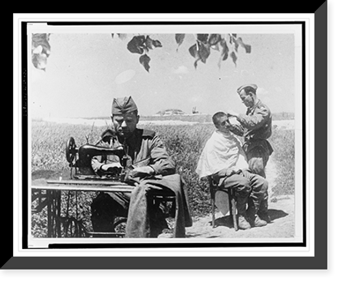 Historic Framed Print, [Soviet soldiers in the field at Novorossiisk, one sewing on a machine while another has a haircut or shave].Evgenii Khaldei.,  17-7/8" x 21-7/8"