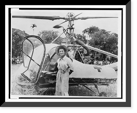 Dr. Val&eacute;rie Andr&eacute;, three-quarter length portrait, standing, facing front, in front of her helicopter in Tonkin, Vietnam Classic, Vintage Wall Art