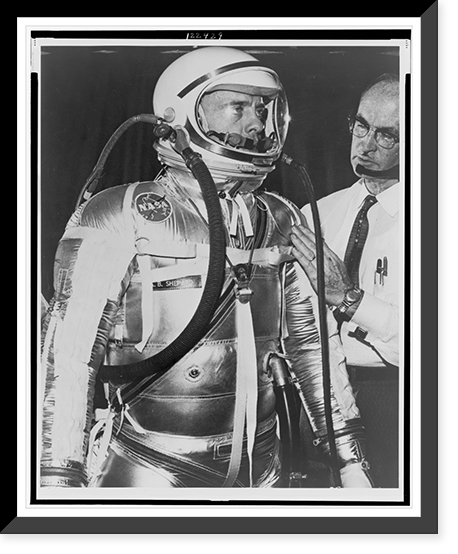 Alan B. Shepard, half-length portrait, facing right, being fitted for life-support space suit by a B.F. Goodrich technician, Vintage Poster