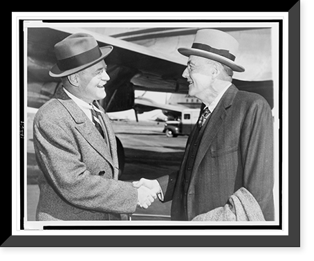 John Foster Dulles (right) shakes hands with his brother Allen Welsh Dulles at La Guardia Field, New York City, Historic Print