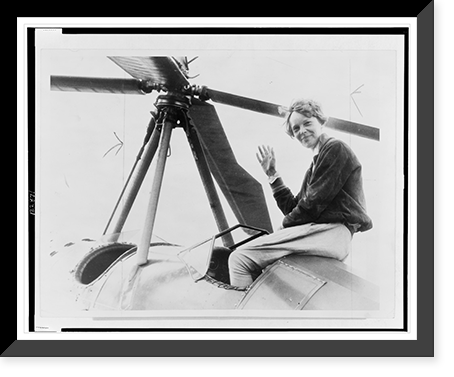Amelia Earhart, waving, seated outside cockpit on top of an autogiro, in Los Angeles, after completing transcontinental flight, Antique Wall Art