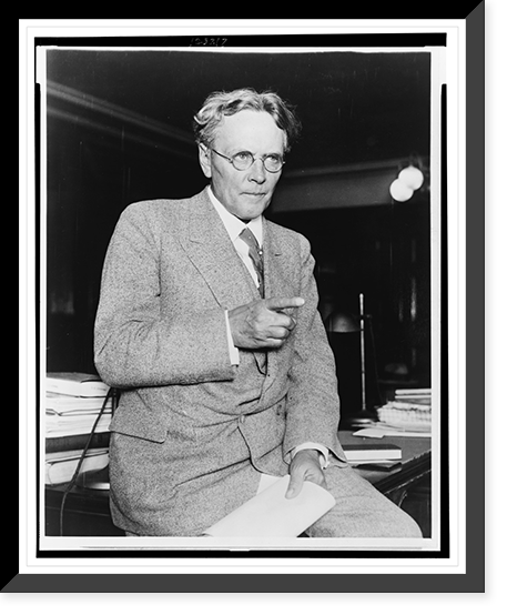 George E. Q. Johnson, three-quarter length portrait, seated on desk, facing front, Vintage Wall Art