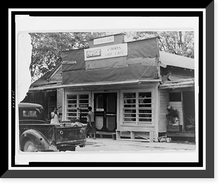 Historic Framed Print, [Two African American women and truck in front of Courts grocery store and cafe],  17-7/8" x 21-7/8"