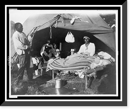 African Americans in front of tent, with one man sitting up on bed, during a Mississippi River flood, Vicksburg National Military Park, Antique Print