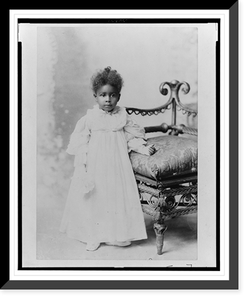 Historic Framed Print, [African American girl, full-length portrait, standing next to chair, facing front],  17-7/8" x 21-7/8"