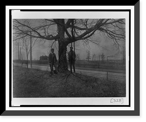 Historic Framed Print, [Two African American men standing next to a tree in Georgia],  17-7/8" x 21-7/8"