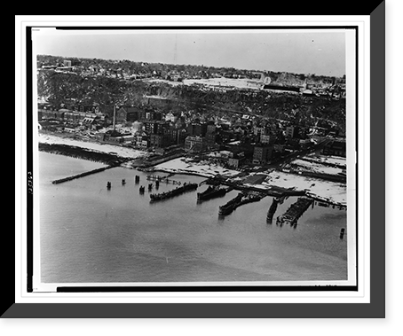 Aerial view of Edgewater, N.J., showing docks on Hudson River, city and amusement park on cliff, Antique Poster