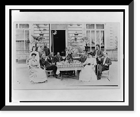 Twelve men and women gathered around a table on a patio, Vintage Wall Art