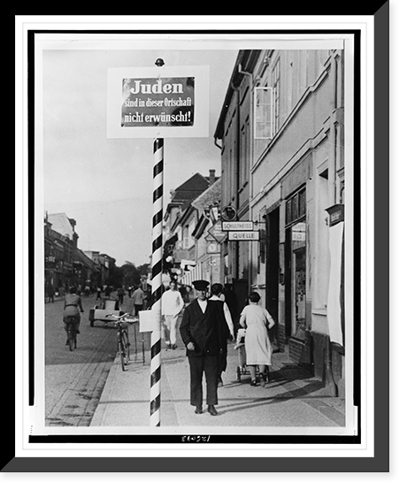 Antisemitic message Jews not wanted" on sign atop a barbershop like striped pole on a sidewalk in a Schwedt, Germany commercial district", Antique Wall Art