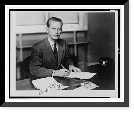 Cecil R. King, California congressman, half-length portrait, seated at desk, facing front, holding a pen, Vintage Print