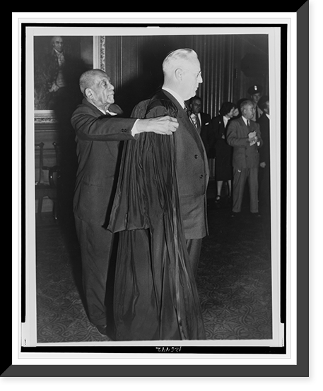 Historic Framed Print, [R.G. Marshall helping Supreme Court Chief Justice Earl Warren on with his robe],  17-7/8" x 21-7/8"