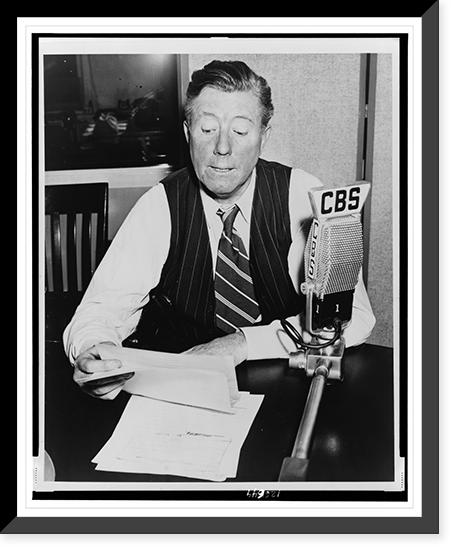 Historic Framed Print, [Frazier Hunt, head-and-shoulders portrait, seated at desk behind CBS microphone],  17-7/8" x 21-7/8"