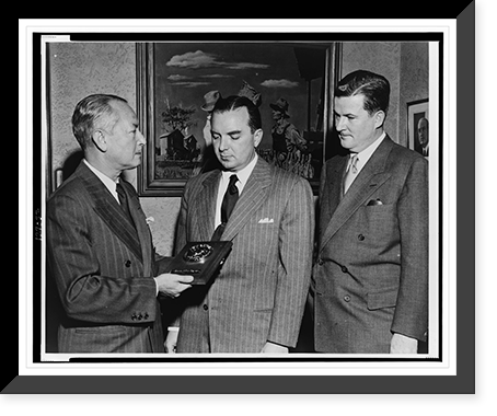 Paul M. Hahn accepts, on behalf of The American Tobacco Company, TV Guide's Gold Medal award for the television commercial of the year from Lee Wagner as A.R. Stevens looks on Timeless Wall Art P