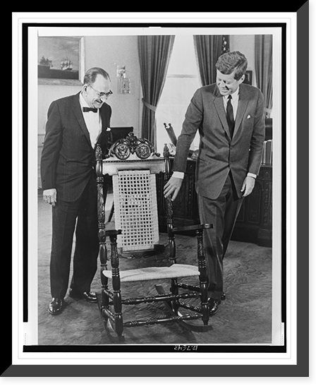President John F. Kennedy examines mahogany rocking chair given by Dominican Republic, as Foreign Minister of the Dominican Republic Dr. Jos&eacute; A. Bonilla Atiles (l) looks on - 2 Heritage Wa