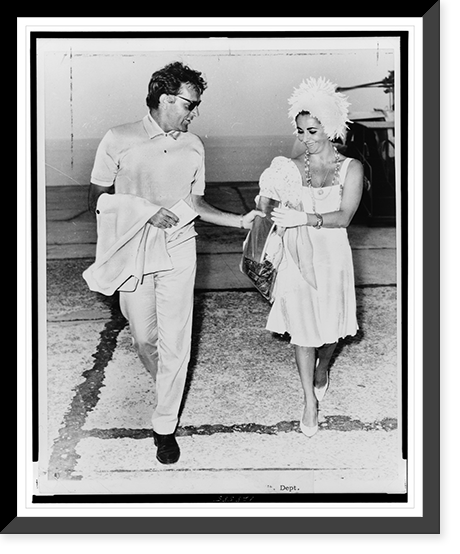 Elizabeth Taylor and Richard Burton full-length portrait, walking, after landing on the Mediterranean island of Ischia to shoot exterior scenes for Cleopatra"", Antique Poster