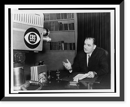 Wisconsin Senator Joseph McCarthy, head-and-shoulders portrait, seated at desk, facing slightly left, speaking in front of a CBS camera in New York's Liederkrantz Hall, Vintage Print