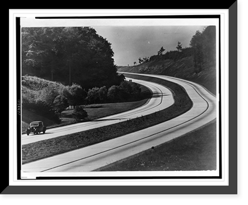 Historic Framed Print, [An automobile on the sweeping curves of the Autobahn with view of the countryside].Dr. Wolf Strache.,  17-7/8" x 21-7/8"