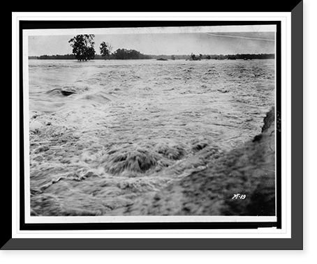 Torrential floodwaters submerging all in its path, trees in background, Vintage Wall Art
