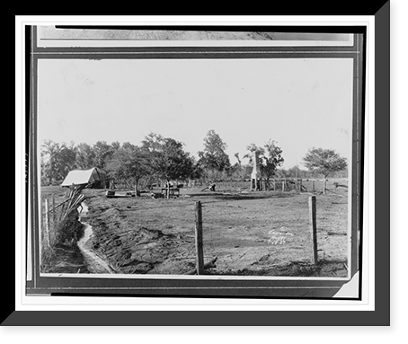 Fencing and a chimney are all that remain on a property after the flood, a roof is in the left background.Ewing, Inc., Baton Rouge, La, Antique Poster
