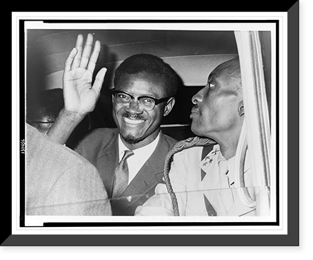 Patrice Lumumba, seated in car, waving as he leaves Idlewild airport, New York City, to attend a meeting with Dag Hammarskj&ouml;ld at the United Nations, Antique Print