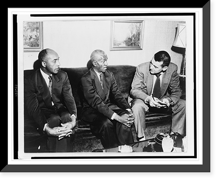 Two unidentified African American men seated on a sofa, talking to a young man, possibly a reporter Classic, Antique Wall Art