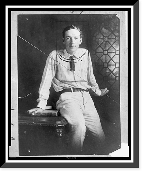 Historic Framed Print, [Upton Sinclair, three-quarter length portrait, seated on desk, facing front],  17-7/8" x 21-7/8"