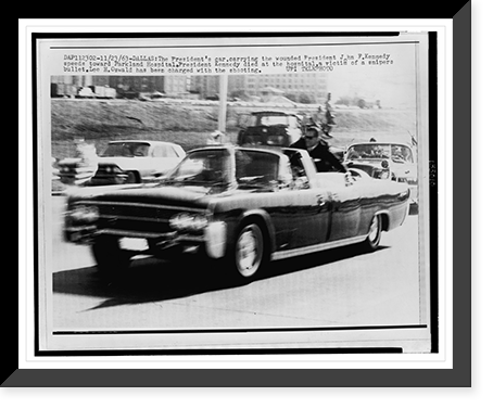Historic Framed Print, The president's car, carrying the wounded President John F. Kennedy, speeds toward Parkland Hospital,  17-7/8" x 21-7/8"