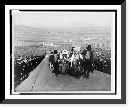 Historic Framed Print, [Entertainers wearing traditional regional dress walking between the crowd of spectators up a long hill following ceremony at the 1935 Erntedankfest (harvest thanksgiving festival)],  17-7/8" x 21-7/8"