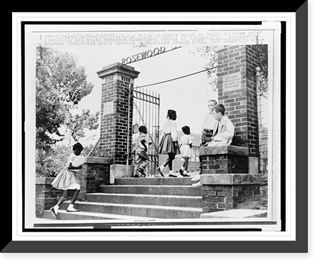 Historic Framed Print, [Two] white students watch as Negro children enter previously all white Rosewood Elementary School in Columbia, S.C., twenty-four Negroes integrated white schools in Richland County 8/31,  17-7/8" x 21-7/8"