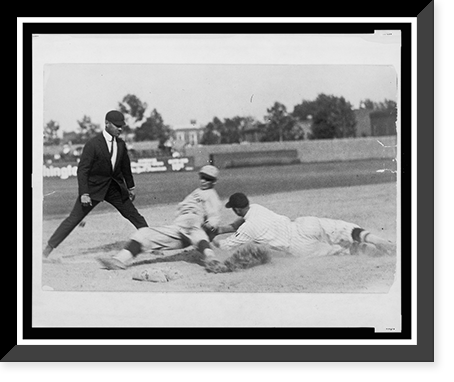 Historic Framed Print, [Umpire ready to make the call as Washington ball player applies tag to base runner sliding into base during baseball game],  17-7/8" x 21-7/8"